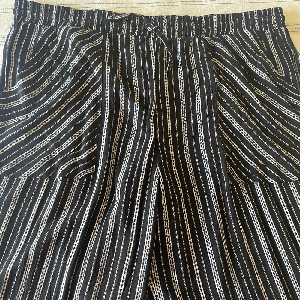 Black with white stripes, palazzo pants. Size XL.
